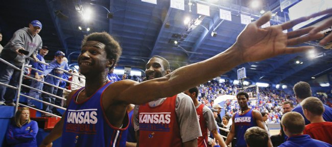 Kansas forward Andrew Wiggins reaches wide to slap hand with fans following an open-practice scrimmage on Saturday, Oct. 19, 2013 at Allen Fieldhouse.
