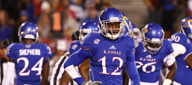 Kansas cornerback Dexter McDonald and the Kansas defense show their disappointment after giving up a touchdown to Baylor during the second quarter on Saturday, Oct. 26, 2013.