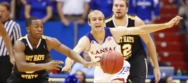 Kansas guard Conner Frankamp knocks the ball away from Fort Hays State guard Craig Nicholson during the second half of an exhibition game on Tuesday, Nov. 5, 2013.