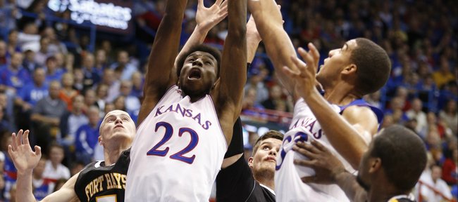 Kansas players Andrew Wiggins (22) and Landen Lucas fight for a rebound with Fort Hays State defenders during the first half of an exhibition game on Tuesday, Nov. 5, 2013.
