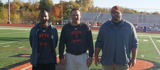 From left, former Kansas University football players Tony Blevins, Jason Thoren and Caleb Blakesley are now coaching just a short drive from Lawrence, at Baker University in Baldwin City.