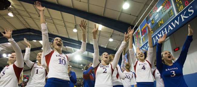 Kansas players celebrate their win following Kansas' volleyball match against in-state rival Kansas State, Saturday at the Horejsi Center. The Jayhawks defeated the Wildcats, 3-1.