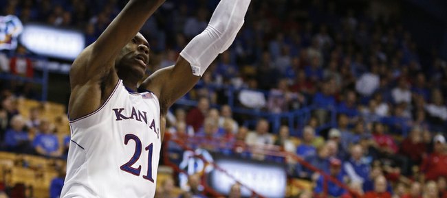 Kansas center Joel Embiid delivers a dunk against Pittsburg State during the second half of an exhibition game on Tuesday, Oct. 29, 2013 at Allen Fieldhouse.