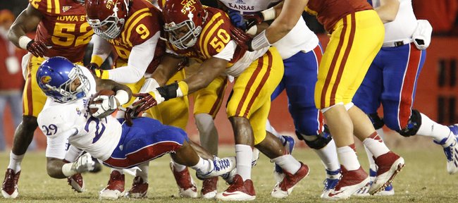 Iowa State defenders collapse around James Sims during the first quarter on Saturday, Nov. 23, 2013 at Jack Trice Stadium in Ames, Iowa.