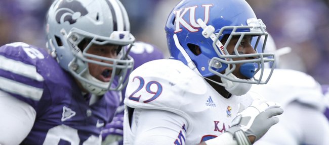 Kansas running back James Sims is trailed by the Kansas State defense during the third quarter on Saturday, Oct. 6, 2012 at Bill Snyder Family Stadium in Manhattan. 