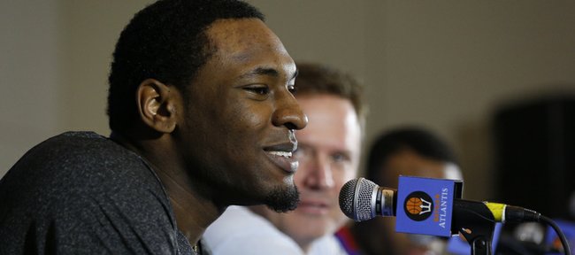 Kansas forward Tarik Black answers a question from a media member during a news conference, Wednesday, Nov. 27, 2013, at the Atlantis Resort in Paradise Island, Bahamas. Kansas will open the Battle 4 Atlantis tournament against Wake Forest at 2:30 p.m. central time on Thursday.