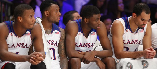 Kansas starters Wayne Selden, left, Naadir Tharpe, Andrew Wiggins and Perry Ellis watch from the bench for a long stretch of the second half of the Battle 4 Atlantis opening round on Thursday, Nov. 28, 2013 in Paradise Island, Bahamas.