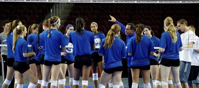 The Kansas University volleyball team huddles after NCAA Tournament practice Thursday at the Galen Center in Los Angeles. 