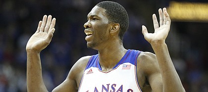 Kansas center Joel Embiid reacts to being called for a foul during the first half on Saturday, Dec. 14, 2013 at Sprint Center in Kansas City, Mo.