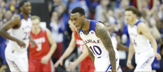 Kansas guard Naadir Tharpe celebrates after hitting a three pointer against New Mexico during the second half on Saturday, Dec. 14, 2013 at Sprint Center in Kansas City, Mo.
