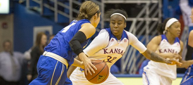 Kansas freshman guard Keyla Morgan (32) pressures Tulsa guard Erika Lane (4) during their game Sunday afternoon at Allen Fieldhouse. The Jayhawks won, 82-78, and will next face Yale on Dec. 29. 2013 in Lawrence.