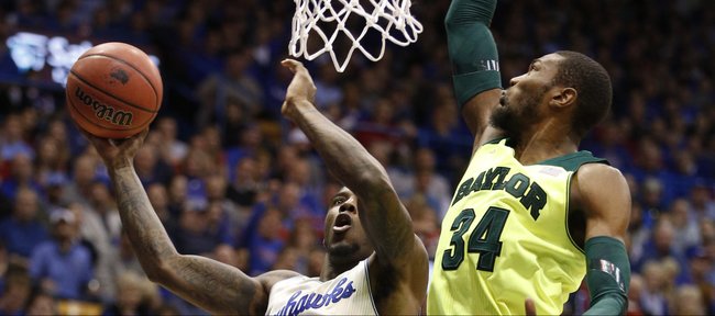 Kansas forward Jamari Traylor maneuvers for a bucket against Baylor forward Cory Jefferson during the first half on Monday, Jan. 20, 2014 at Allen Fieldhouse.