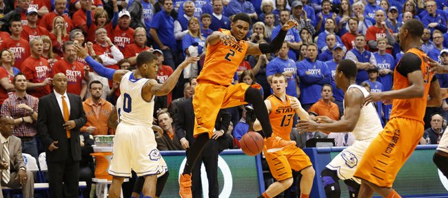 Oklahoma State forward Le'Bryan Nash loses the ball before Kansas defenders Frank Mason (0) and Wayne Selden on the final possession as time expires during the second half on Saturday, Jan. 18, 2014 at Allen Fieldhouse.