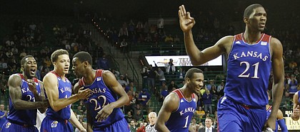 From left Jamari Traylor and Brannen Greene congratulate Andrew Wiggins, center, after Wiggins hit a long three-point basket to end the first half. Also celebrating at right are Wayne Selden and Joel Embiid Tuesday, Feb. 4, 2014 at Ferrell Center in Waco, Texas.