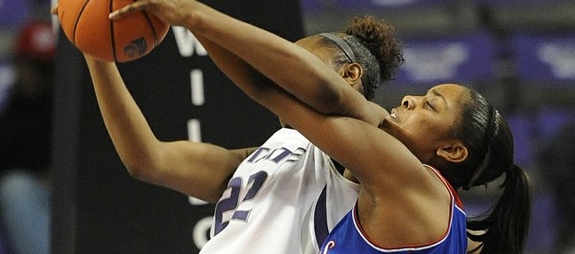 KU's Chelsea Gardner, right, contests a possession by KSU's Breanna Lewis on Saturday, Jan. 25, 2014, in Manhattan.