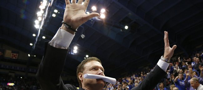 Kansas head coach Bill Self raises up two palms in light of the the Jayhawks' tenth-straight conference title following their 83-75 win over Oklahoma on Monday, Feb. 24, 2014 at Allen Fieldhouse.