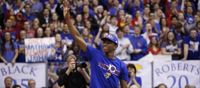 Kansas guard Andrew Wiggins, who most likely will enter the NBA Draft waves to the fieldhouse prior to the senior speeches on Wednesday, March 5, 2014 at Allen Fieldhouse.