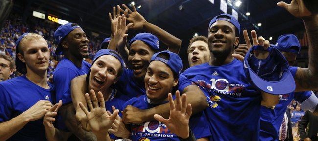 Kansas players huddle together celebrating the programs' tenth-straight conference title following their 82-57 win over Texas Tech on Wednesday, March 5, 2014 at Allen Fieldhouse.
