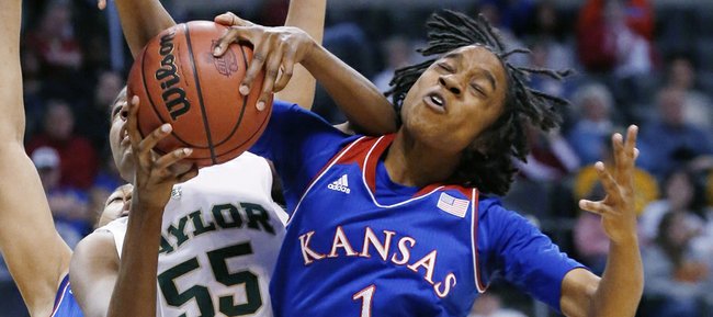 Kansas University's Lamaria Cole (1) and Baylor's Khadijiah Cave (55) fight for a rebound in the second half of an NCAA college basketball game in the quarterfinals of the Big 12 Conference women's college tournament in Oklahoma City, Saturday, March 8, 2014. Baylor won 81-47.
