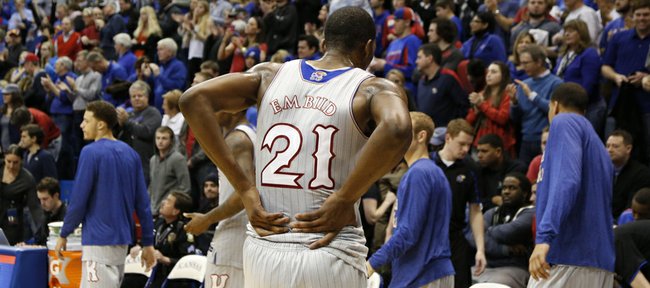 Kansas center Joel Embiid walks off the court holding his lower back after injuring it during the second half of the Jayhawks' Feb. 8, 2014 game against West Virginia at Allen Fieldhouse.