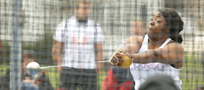 Kansas' Daina Levy spins through her routine as she prepares to throw during the preliminary round of the Hammer Throw event of the Kansas Relays, Thursday, April 17, 2014 outside Memorial Stadium.