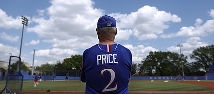Kansas University baseball coach Ritch Price watches over practice on May 15, 2014, at Hoglund Ballpark. Price has led the Jayhawks to the NCAA Tournament for the third time in his 12 years as KU’s head coach.
