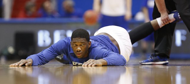 Kansas center Joel Embiid stares across the court as he stretches out prior to tipoff against San Diego State on Sunday, Jan. 5, 2013 at Allen Fieldhouse.