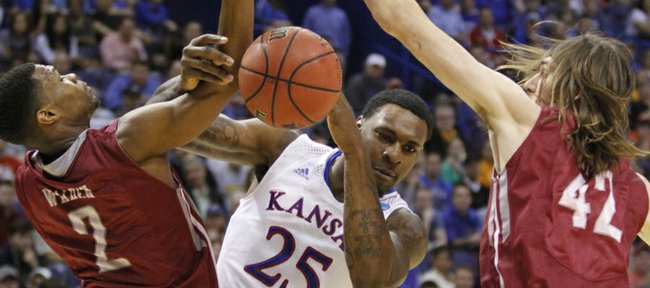 Kansas center Tarik Black drives to the basket through defenders during the Jayhawks win against the Eastern Kentucky Colonels Friday at the Scottrade Center in St. Louis.