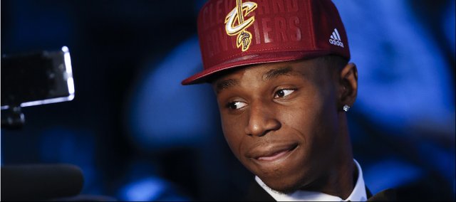 Andrew Wiggins of Kansas stops for a television interview after being selected by the Cleveland Cavaliers as the number one pick in the 2014 NBA draft, Thursday, June 26, 2014, in New York. (AP Photo/Kathy Willens)