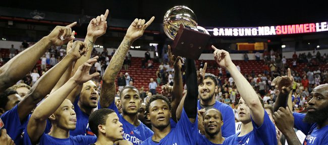 Ben McLemore, center, and his Sacramento Kings teammates celebrate their NBA summer-league championship Monday in Las Vegas.