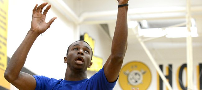 Andrew Wiggins easily gets the rebound during a scrimmage with young players at Bill Self's youth camp on Sunday, Aug. 10, 2014, at Shawnee Mission West High.