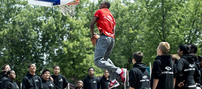 NBA first-overall draft pick Andrew Wiggins goes up for a dunk while shooting a commercial Monday after signing an endorsement deal with BioSteel Sports Drink at his old school in Concord, Ontario.