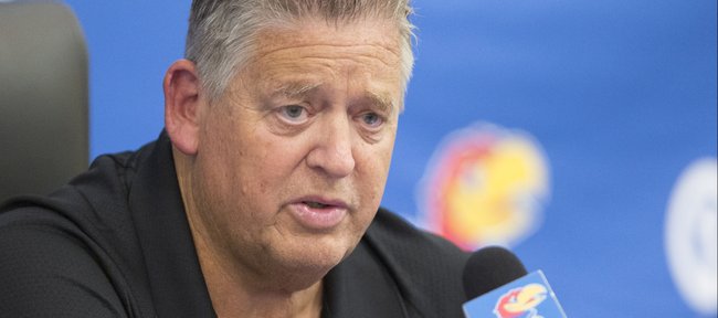 Kansas head football coach Charlie Weis answers questions from media members during a press conference  on Tuesday, Sept. 16, 2014 in Mrkonic Auditorium. Weis addressed preparations for the Jayhawks' upcoming home game against Central Michigan and also the play of quarterback Montell Cozart, which he hopes to be improved by this weekend.