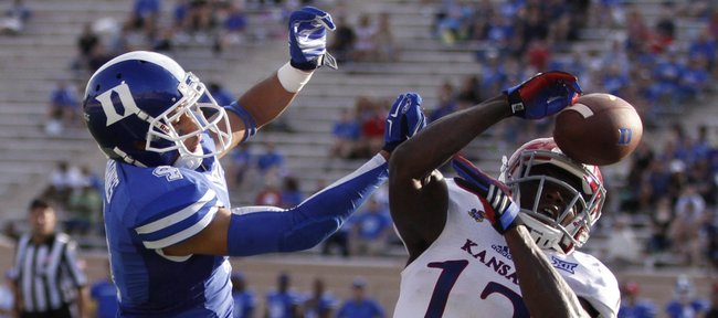 Kansas cornerback Dexter McDonald is called for pass interference on this breakup with Duke receiver Johnell Barnes during the fourth quarter on Saturday, Sept. 13, 2013 at Wallace Wade Stadium in Durham, North Carolina.