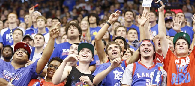 Jayhawk fans look to draw the attention of the cameras during Late Night in the Phog, Friday, Oct. 4, 2013 at Allen Fieldhouse.