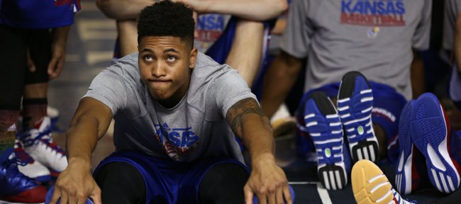 Freshman Kelly Oubre gets stretched in the tunnel as the team waits to be introduced to the crowd during Late Night in the Phog on Friday, Oct. 10, 2014 at Allen Fieldhouse.