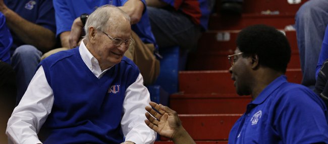 Former Kansas head coach Ted Owens chats it up with former player Tommie Smith on Saturday, Feb. 8, 2014 at Allen Fieldhouse. Owens' 1974 Final Four team was honored during the first half of Saturday's game.