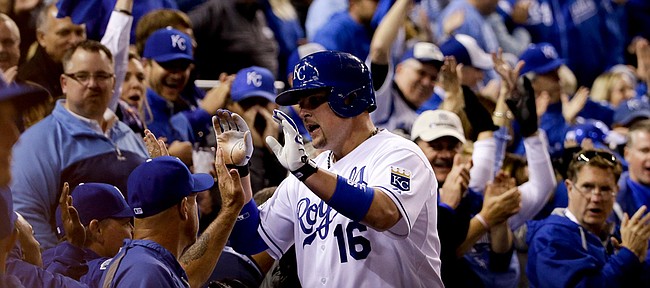Kansas City Royals' Billy Butler celebrates after scoring on a hit by Alex Gordon during the second inning of Game 7 of baseball's World Series Wednesday, Oct. 29, 2014, in Kansas City, Mo.