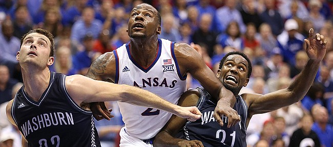 Kansas forward Cliff Alexander works between Washburn players Alex North (22) and Kevin House during the second half on Monday, Nov. 3, 2014 at Allen Fieldhouse.