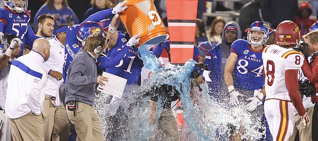 Kansas interim head football coach Clint Bowen gets doused in a Gatorade bath in the final seconds of the Jayhawks' 34-14 win over Iowa State on Saturday, Nov. 8, 2014.