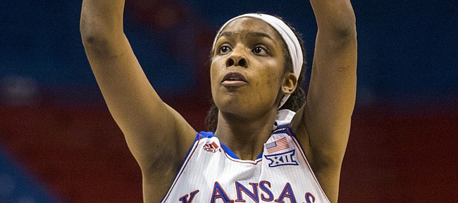 Kansas senior forward Chelsea Gardner scores one of her game high 24 points during the second half of Kansas' game against South Dakota Sunday afternoon at Allen Fieldhouse. The Jayhawks held off the Coyotes, 68-60, for a season opening victory. Despite being in foul trouble for much of the game, Gardner's 24 points put her in the 1,000 career points club at KU.