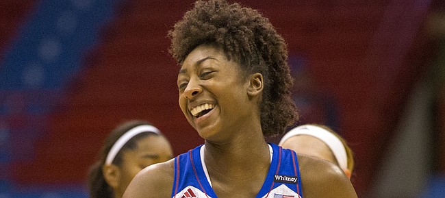 Kansas freshman guard Chayla Cheadle is all smiles as she comes to the bench during a time out in Kansas' game against Texas Southern Tuesday evening at Allen Fieldhouse.