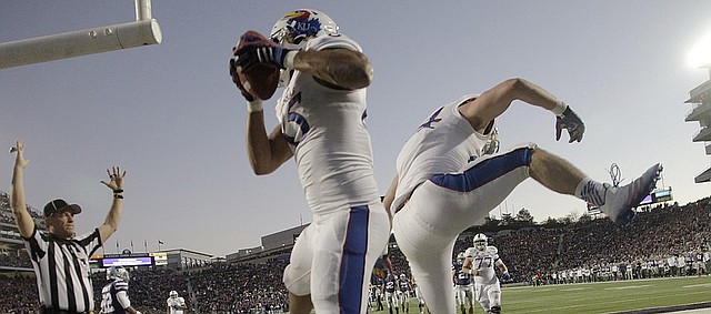Kansas receiver Trent Smiley, left, and tight end Ben Johnson, celebrate Smiley's second-half touchdown catch during the Jayhawks 51-13 loss to the Kansas State Wildcats Saturday in Manhattan. 