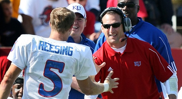 Kansas University receivers coach David Beaty, right, congratulates Todd Reesing on a play in this file photo from the 2008 season.