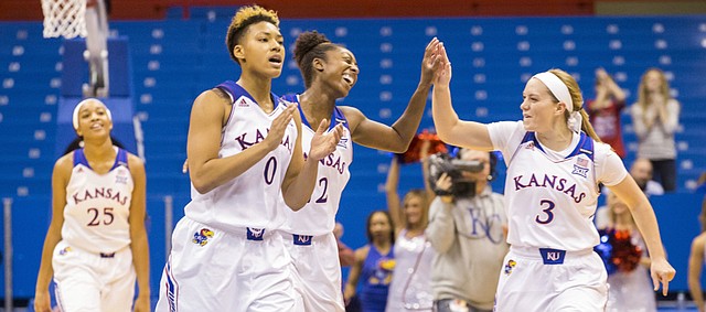 Kansas players were all smiles as they head towards the bench after defeating No. 10 Cal, 62-39, Sunday at Allen Fieldhouse.