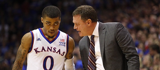 Kansas head coach Bill Self has a chit-chat with point guard Frank Mason during the second half on Friday, Dec. 5, 2014 at Allen Fieldhouse.