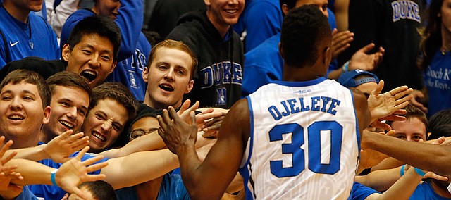 The Cameron Crazies salute Semi Ojeleye (30) and the rest of the Blue Devils following their 113-44 win over Presbyterian in Durham, N.C., Friday, Nov. 14, 2014.