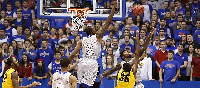 Kansas forward Cliff Alexander (2) gets up to reject a shot from Kent State forward Jimmy Hall (35) during the second half on Tuesday, Dec. 30, 2014 at Allen Fieldhouse.