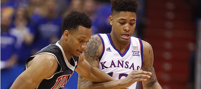 Kansas guard Kelly Oubre Jr. (12) knocks the ball away from UNLV guard Rashad Vaughn (1) for a steal during the second half on Sunday, Jan. 4, 2015 at Allen Fieldhouse.