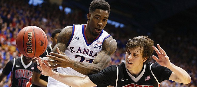 Kansas forward Jamari Traylor (31) fights for control of a rebound with UNLV guard Cody Doolin (45) during the second half on Sunday, Jan. 4, 2015 at Allen Fieldhouse.